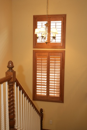 Wooden shutters in tan staircase.